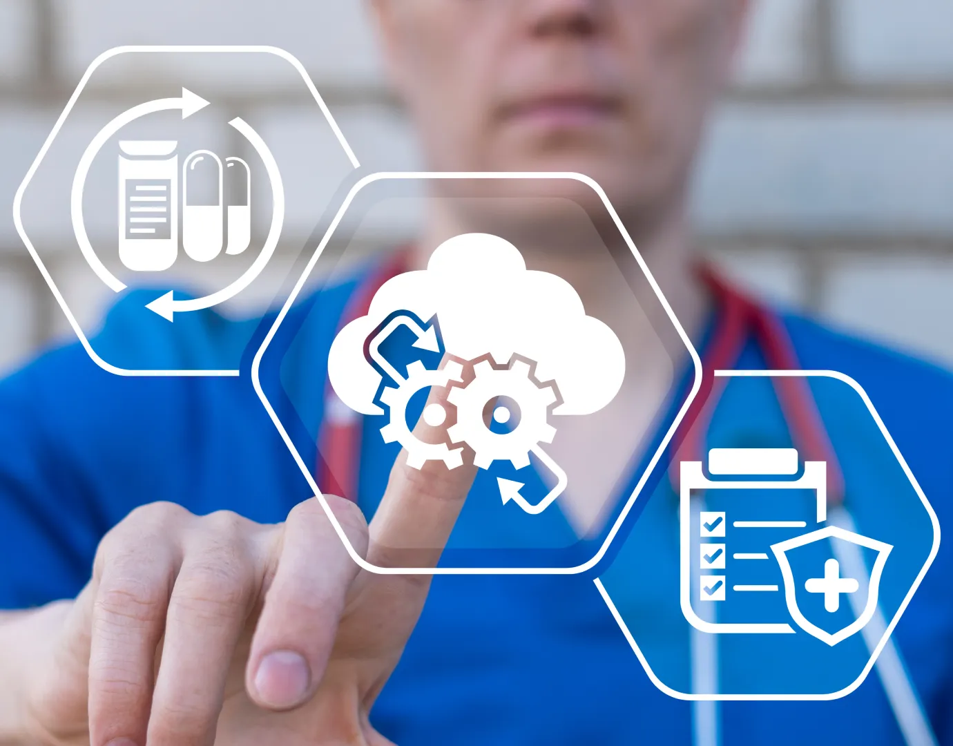 Clinical staff member pointing to hexagonal icons representing cloud-based healthcare workflow tools.