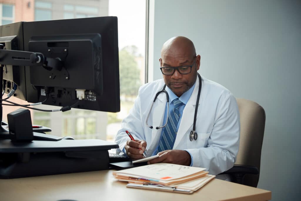 Doctor working on computer