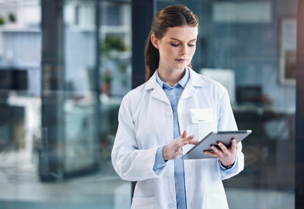 She has lots to check up on. a young female doctor using a digital tablet in a hospital