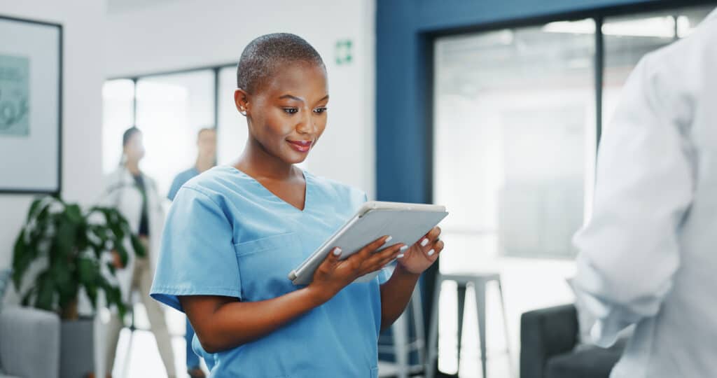 Happy woman or black doctor face in busy hospital with tablet for healthcare services, leadership and mindset. Portrait of medical professional or female nurse on telehealth app for clinic management.
