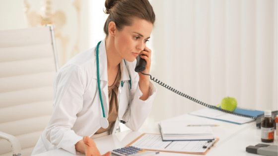 Doctor on phone at her desk