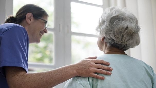 Nurse taking care of an elder woman