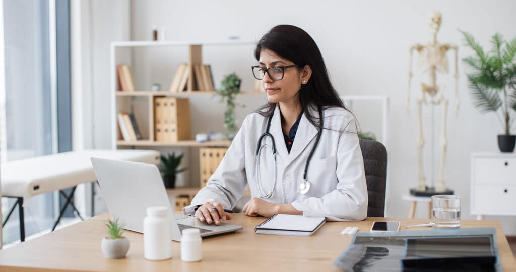 Medical staff using practice management software with key features