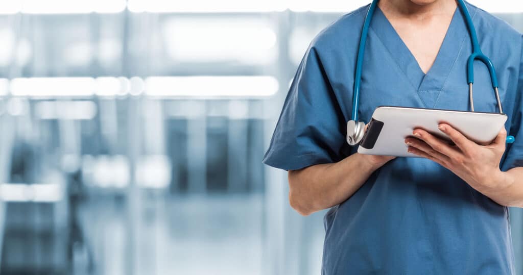Medical staff scheduling appointments with practice management software.
