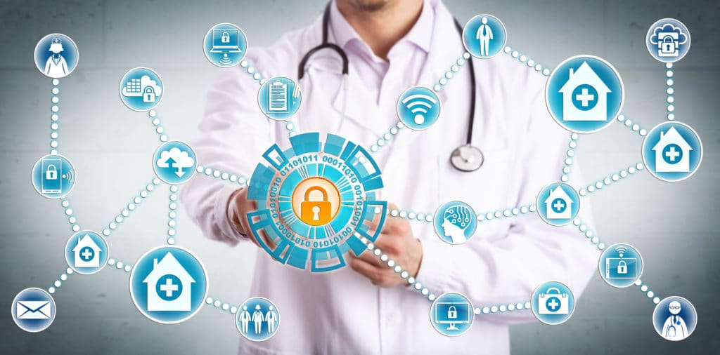 Young male clinician securely sharing sensitive healthcare data across mobile devices and medical practices. IT concept for cybersecurity and secure information sharing in the health care industry.