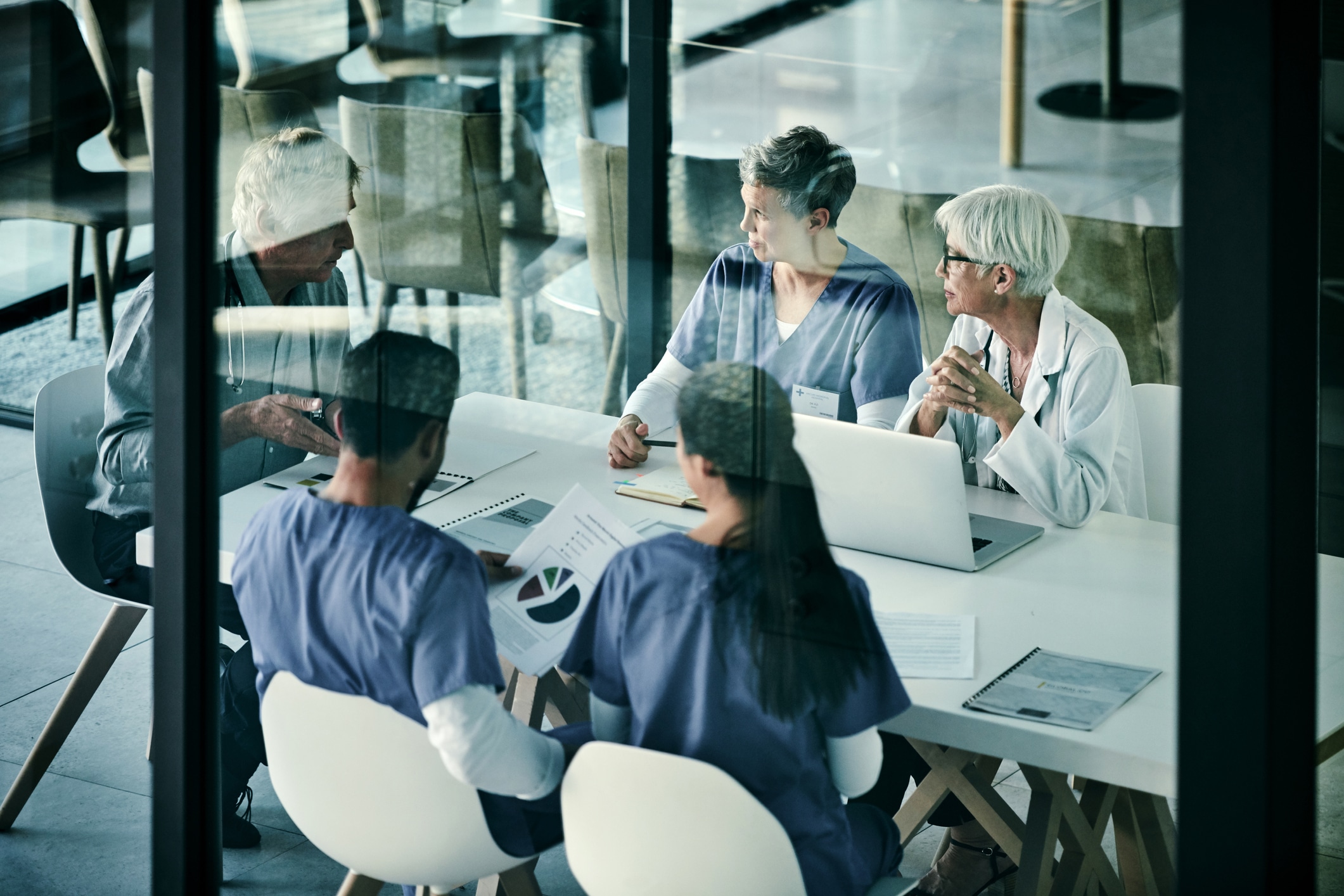 Shot of a group of medical professionals having a meeting together inside a boardroom at a hospital