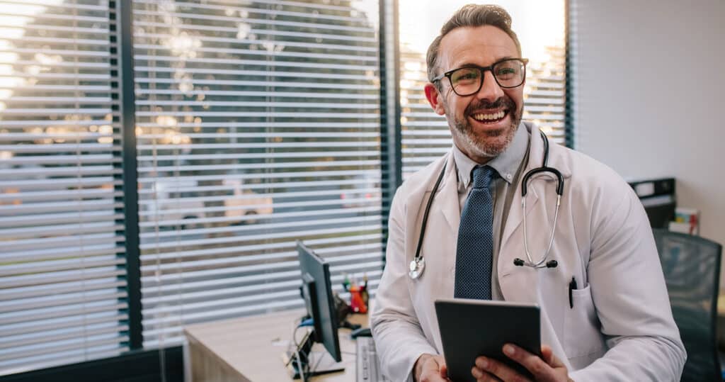 Doctor using practice management software.