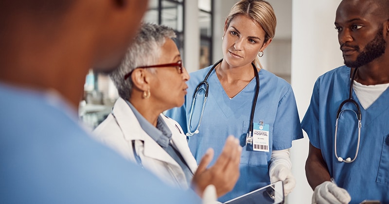 Doctor mentoring a young nurse during a training session