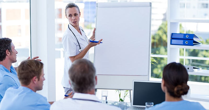 Team of healthcare workers discussing best practices