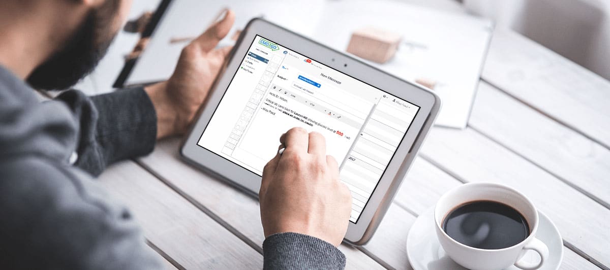 Man using CMD2GO on tablet while having coffee.