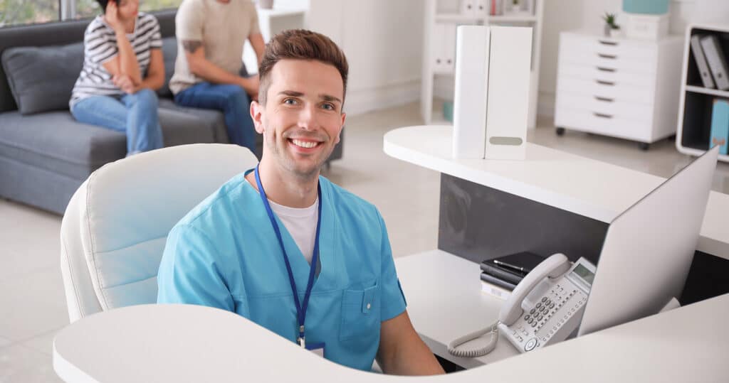 Doctor reviewing SMS billing platform for patient outreach